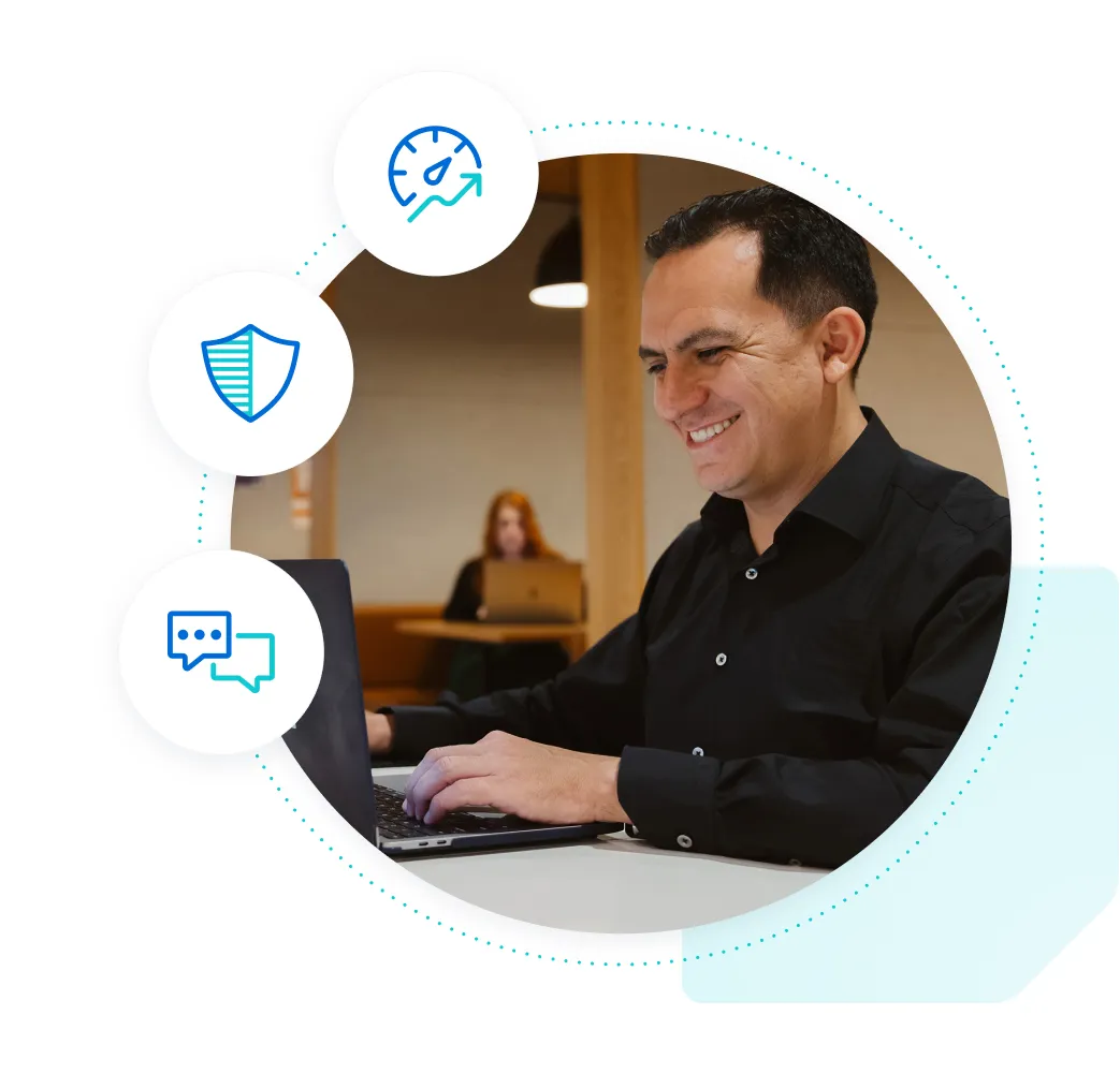 Man in a black button-down shirt at a desk with a laptop smiling and typing with icons representing speed, security, and support surrounding.